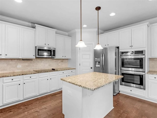 149 Elkins Blvd, Locust Grove, GA 30248 - kitchen with stainless steel appliances, dark wood-style floors, crown molding, white cabinets, and recessed lighting