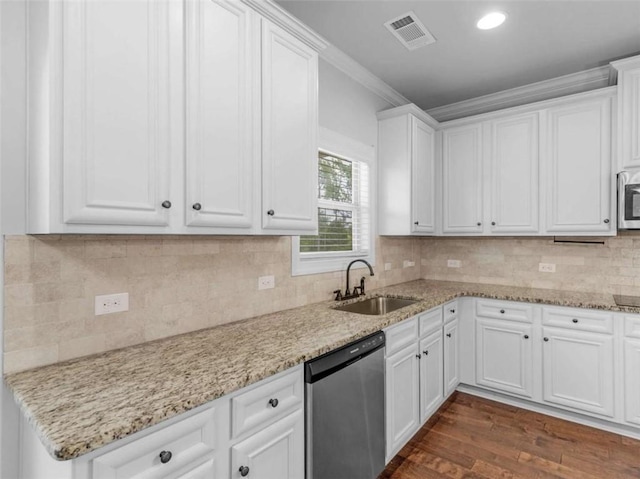149 Elkins Blvd, Locust Grove, GA 30248 - kitchen with dishwashing machine, ornamental molding, dark wood finished floors, white cabinets, and stainless steel microwave
