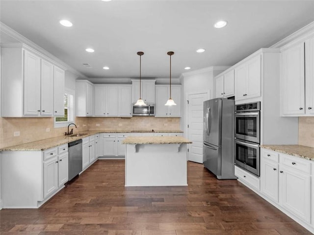 149 Elkins Blvd, Locust Grove, GA 30248 - kitchen featuring appliances with stainless steel finishes, a center island, white cabinetry, backsplash, and recessed lighting