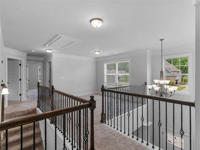149 Elkins Blvd, Locust Grove, GA 30248 - hallway featuring carpet, ornamental molding, an upstairs landing, a chandelier, and attic access