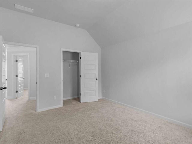 149 Elkins Blvd, Locust Grove, GA 30248 - unfurnished bedroom with lofted ceiling, light carpet, and a closet