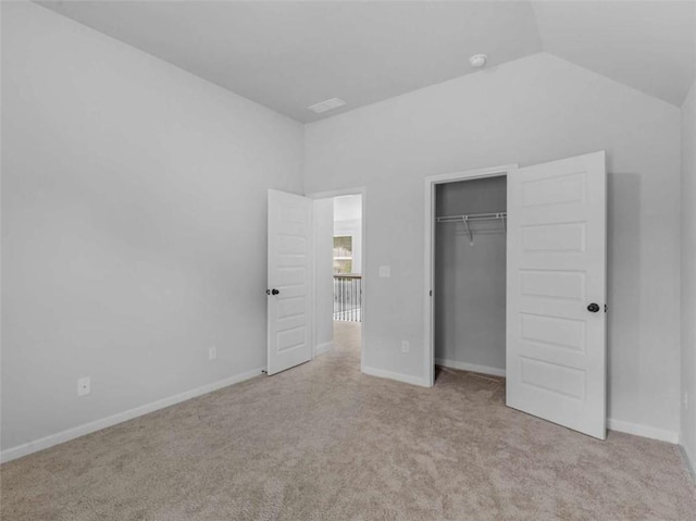 149 Elkins Blvd, Locust Grove, GA 30248 - unfurnished bedroom with carpet, vaulted ceiling, and a closet