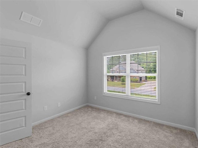 149 Elkins Blvd, Locust Grove, GA 30248 - carpeted spare room featuring lofted ceiling and baseboards