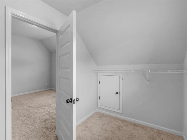 149 Elkins Blvd, Locust Grove, GA 30248 - additional living space featuring vaulted ceiling and carpet