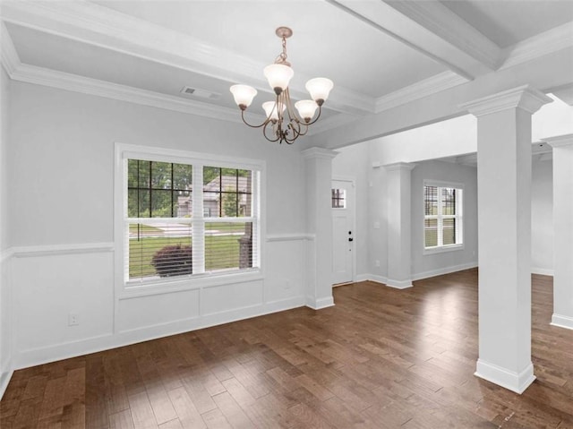 149 Elkins Blvd, Locust Grove, GA 30248 - unfurnished dining area featuring decorative columns, hardwood / wood-style floors, a chandelier, crown molding, and wainscoting