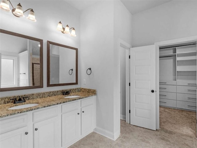 149 Elkins Blvd, Locust Grove, GA 30248 - bathroom with double vanity and tile patterned floors