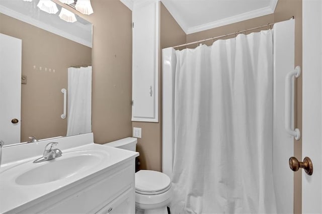 bathroom featuring vanity, ornamental molding, and toilet