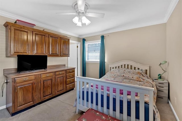 bedroom with ceiling fan, light colored carpet, and ornamental molding