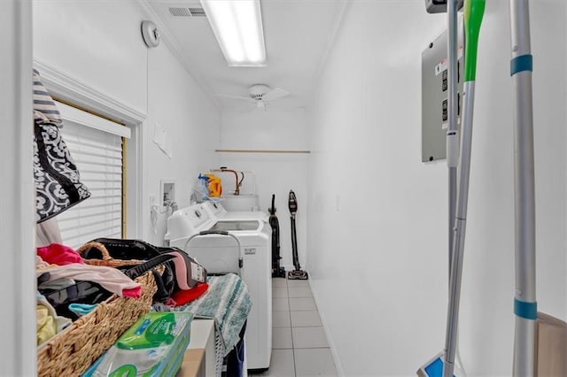 laundry room with ceiling fan, light tile patterned floors, and washer and clothes dryer