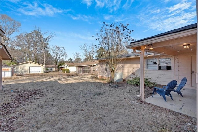 view of yard with an outbuilding and a patio area