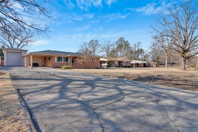 ranch-style house featuring a garage