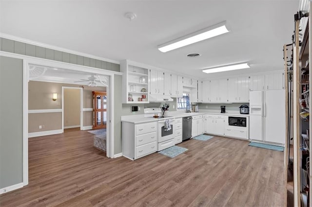 kitchen featuring hardwood / wood-style floors, white cabinetry, ceiling fan, crown molding, and white appliances