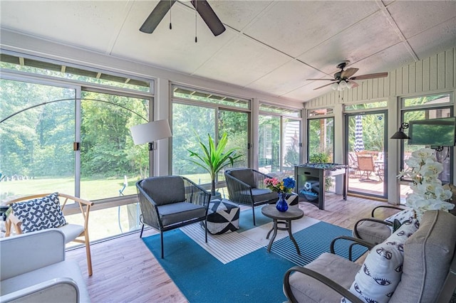 sunroom / solarium featuring ceiling fan and lofted ceiling