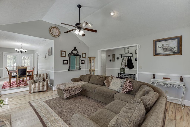 4434 Hidden Oaks Dr, Flowery Branch, GA 30542 - living room with a chandelier, light wood-style floors, ceiling fan, and high vaulted ceiling