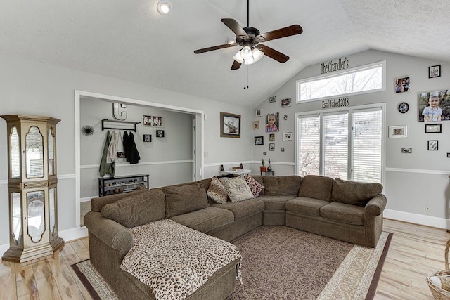 4434 Hidden Oaks Dr, Flowery Branch, GA 30542 - living area featuring ceiling fan, vaulted ceiling, a textured ceiling, and light wood-style flooring