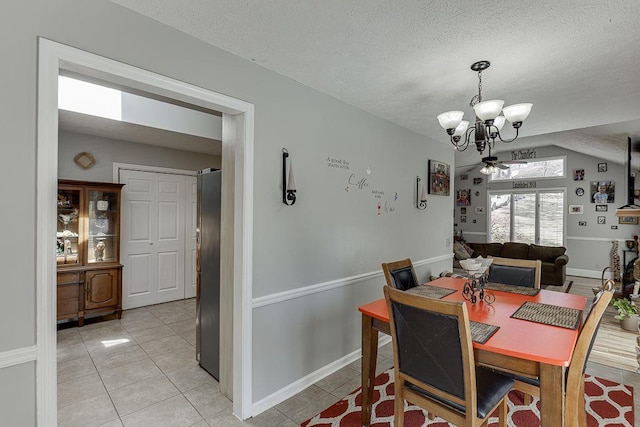 4434 Hidden Oaks Dr, Flowery Branch, GA 30542 - dining room featuring a chandelier, light tile patterned floors, and a textured ceiling