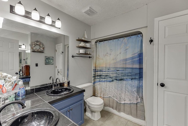 4434 Hidden Oaks Dr, Flowery Branch, GA 30542 - full bathroom featuring tile patterned floors, vanity, a shower with curtain, and a textured ceiling