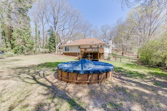 4434 Hidden Oaks Dr, Flowery Branch, GA 30542 - fenced backyard with a wooden deck, stairs, and a covered pool