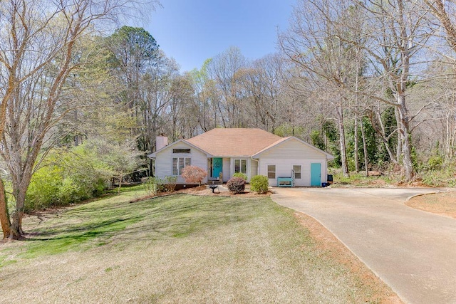 4434 Hidden Oaks Dr, Flowery Branch, GA 30542 - single story home with a chimney, concrete driveway, and a front lawn