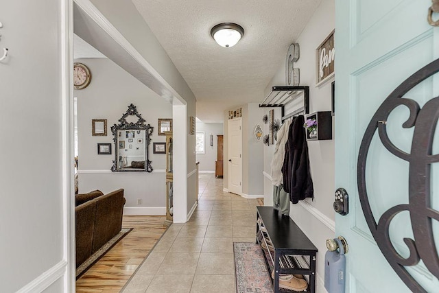 4434 Hidden Oaks Dr, Flowery Branch, GA 30542 - entrance foyer with a textured ceiling and light tile patterned floors