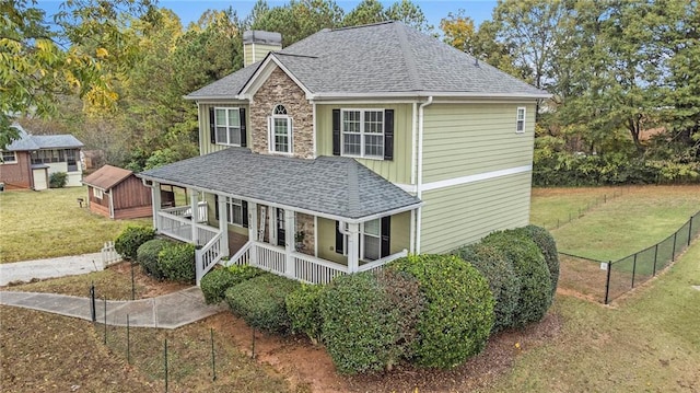 exterior space featuring a front yard and covered porch