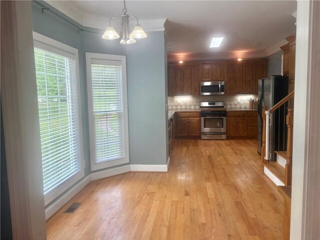 living room featuring ornamental molding and wood-type flooring