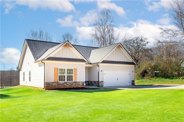 craftsman house with a garage and a front yard