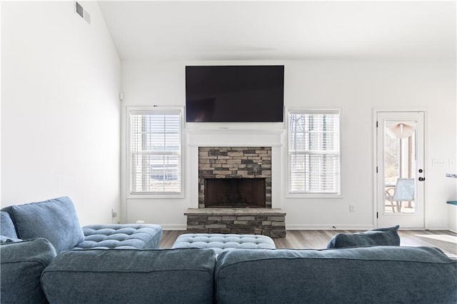 living room with hardwood / wood-style floors and a fireplace