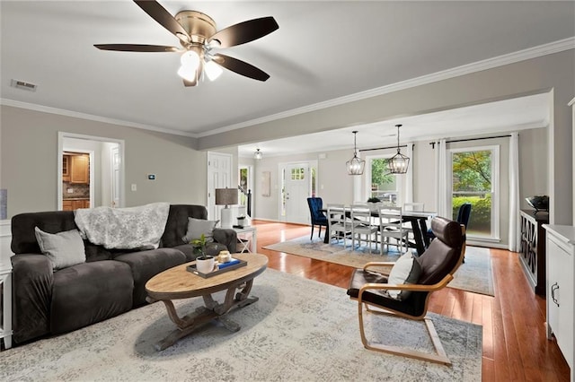 4504 Reva Way NE, Marietta, GA 30066 - living area featuring crown molding, wood finished floors, and ceiling fan