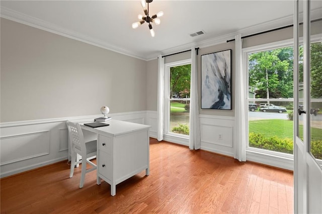 4504 Reva Way NE, Marietta, GA 30066 - home office with a chandelier, ornamental molding, healthy amount of natural light, light wood-style flooring, and a decorative wall