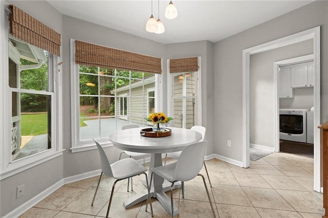 4504 Reva Way NE, Marietta, GA 30066 - dining space with plenty of natural light, separate washer and dryer, light tile patterned flooring, and baseboards