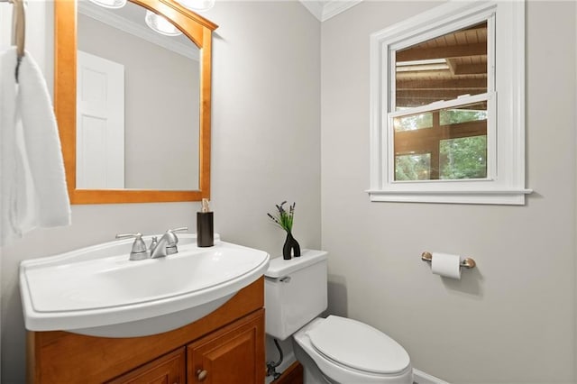 4504 Reva Way NE, Marietta, GA 30066 - half bathroom with toilet, vanity, ornamental molding, and baseboards