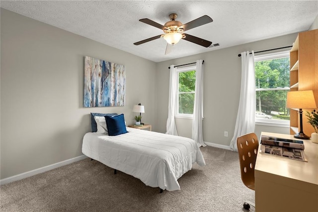 4504 Reva Way NE, Marietta, GA 30066 - carpeted bedroom with baseboards, a textured ceiling, and ceiling fan