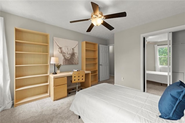 4504 Reva Way NE, Marietta, GA 30066 - bedroom featuring a closet, light carpet, a desk, a textured ceiling, and ceiling fan