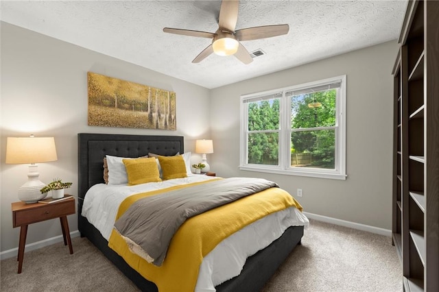 4504 Reva Way NE, Marietta, GA 30066 - carpeted bedroom featuring baseboards, a textured ceiling, and ceiling fan