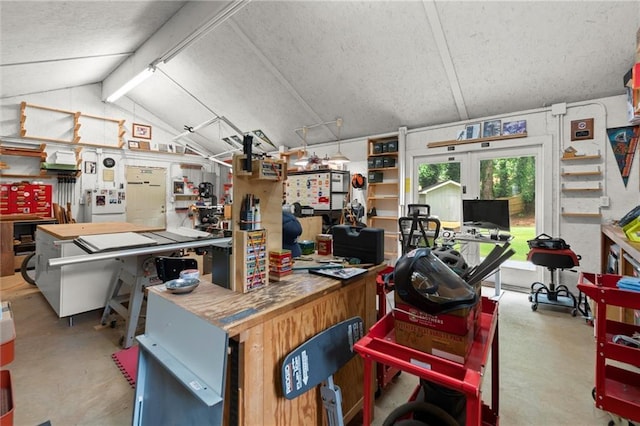 4504 Reva Way NE, Marietta, GA 30066 - miscellaneous room with a workshop area, concrete flooring, vaulted ceiling, and a textured ceiling