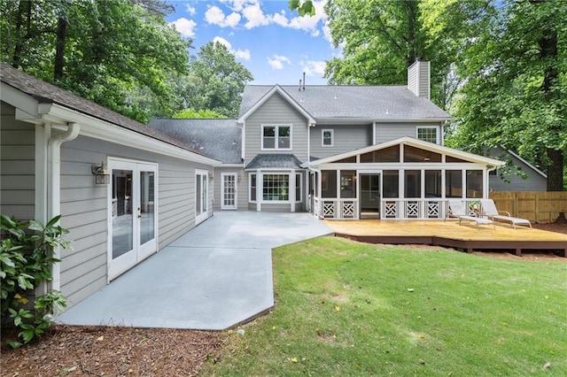 4504 Reva Way NE, Marietta, GA 30066 - rear view of property with a sunroom, a chimney, a patio, french doors, and a deck
