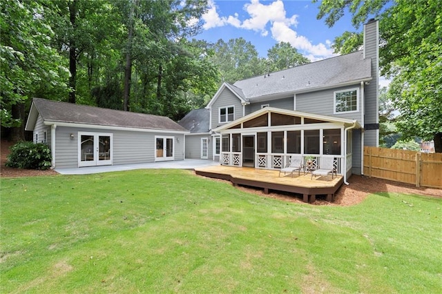 4504 Reva Way NE, Marietta, GA 30066 - rear view of house featuring french doors, a sunroom, a wooden deck, a chimney, and a patio