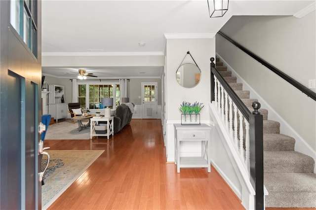4504 Reva Way NE, Marietta, GA 30066 - foyer entrance featuring stairs, light wood-type flooring, ornamental molding, and ceiling fan