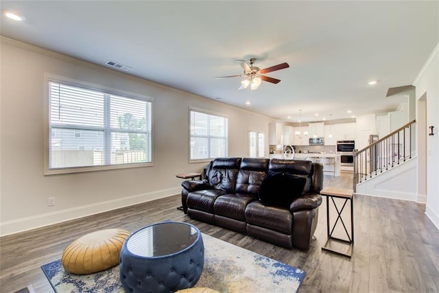 42 Citrine Way, Acworth, GA 30101 - living room featuring ornamental molding, ceiling fan, baseboards, wood finished floors, and recessed lighting