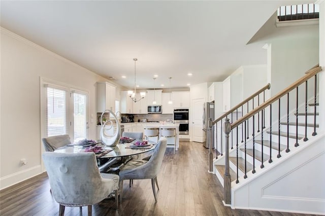 42 Citrine Way, Acworth, GA 30101 - dining room with dark wood-style floors, stairs, baseboards, recessed lighting, and crown molding