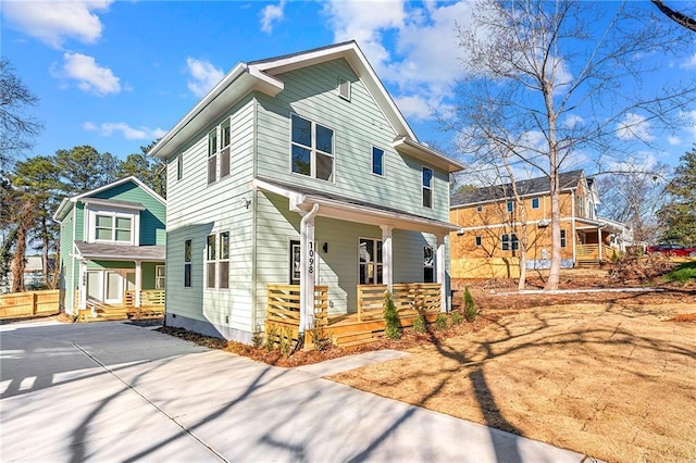 view of front of property with covered porch and driveway