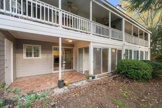 rear view of property featuring a patio and a ceiling fan