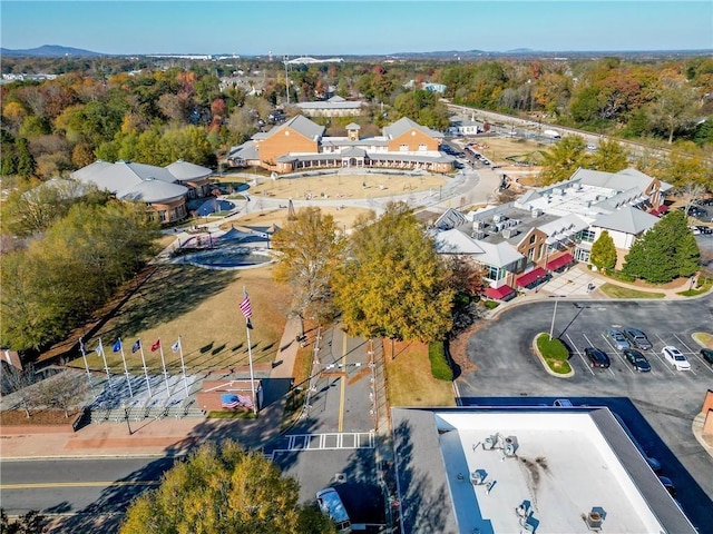 aerial view featuring a wooded view