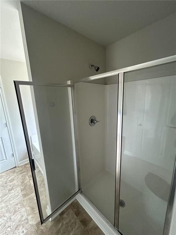 bathroom with a shower stall