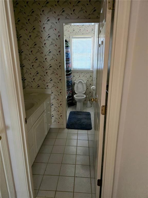275 Rose Ivy Ct, Lawrenceville, GA 30043 - bathroom featuring tile patterned flooring, vanity, wallpapered walls, and toilet