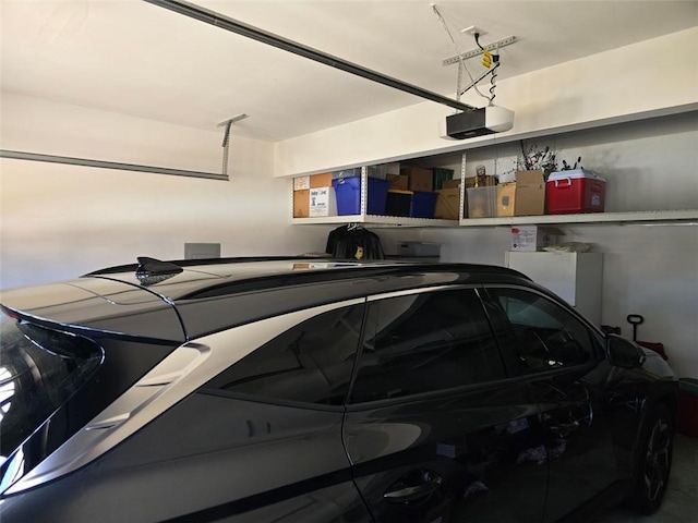 275 Rose Ivy Ct, Lawrenceville, GA 30043 - garage with fridge and a garage door opener