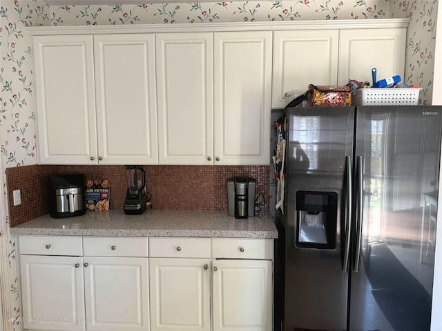275 Rose Ivy Ct, Lawrenceville, GA 30043 - kitchen featuring white cabinets, stainless steel refrigerator with ice dispenser, and wallpapered walls