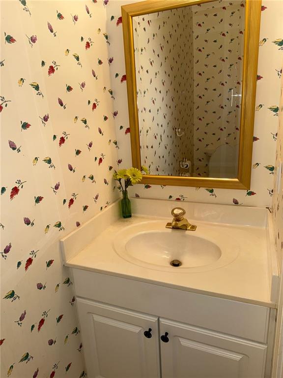 275 Rose Ivy Ct, Lawrenceville, GA 30043 - bathroom with vanity and wallpapered walls