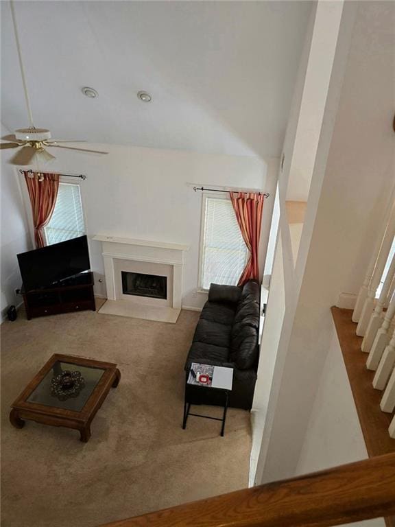 275 Rose Ivy Ct, Lawrenceville, GA 30043 - living area with a fireplace with flush hearth, carpet, and ceiling fan